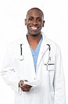 Friendly Middle Aged Male Doctor Posing Stock Photo