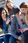 Friends Having Fun With Smartphones Stock Photo