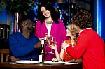 Friends Toasting After Hearing A Great News Stock Photo