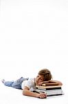 Front View Of Boy Sleeping On Books Stock Photo