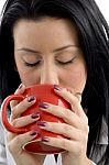 Front View Of Female Doctor Drinking Coffee On White Background Stock Photo