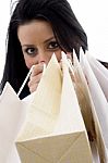 Front View Of Model Showing Shopping Bags Stock Photo