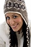 Front View Of Pleased Female With Woolen Cap Stock Photo