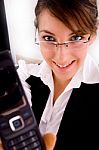 Front View Of Smiling Businesswoman Showing Her Cellphone Stock Photo