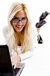 Front View Of Smiling Businesswoman Working On Laptop Stock Photo