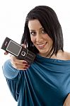 Front View Of Smiling Female Showing Mobile On White Background Stock Photo