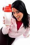 Front View Of Smiling Female With Bottle On White Background Stock Photo