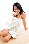 Front View Of Woman Showing Toothbrush Against White Background Stock Photo