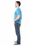 Full Length Of Casual Man Posing Side Ways Stock Photo