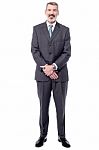 Full Length Of Happy Senior Businessman Stock Photo