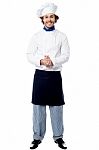 Full Length Portrait Of A Handsome Chef Stock Photo