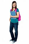 Full Length Portrait Of Pretty College Girl Stock Photo