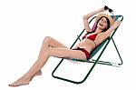 Full Length Portrait Of Relaxed Cheerful Bikini Woman Stock Photo