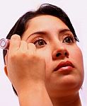 Girl Applying Cosmetics To Face Stock Photo