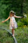 Girl Balancing On The Railroad Stock Photo