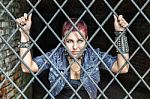 Girl Behind Bars Stock Photo