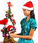 Girl Decorating Christmas Tree Stock Photo