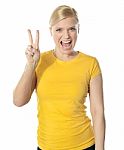 Girl Doing Victory Sign Stock Photo