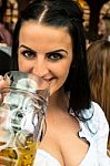 Girl Drinking Beer At Oktoberfest Stock Photo