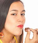 Girl Eating Chocolate Stock Photo