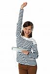 Girl Enjoying Ipad With Raised Arm Stock Photo