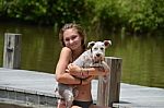 Girl Holding Schnauzer Stock Photo