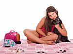 Girl In Swimsuit At The Beach With Dog Stock Photo