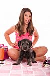 Girl In Swimsuit At The Beach With Dog Stock Photo