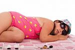 Girl In Swimsuit Sleeping At The Beach Stock Photo