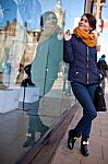 Girl Is Looking At Shop Window Stock Photo