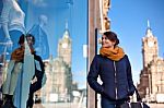 Girl Is Looking At Shop Window Stock Photo