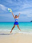 Girl Jumping With Happy On The Beach At Thailand Stock Photo