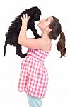 Girl Kissing Dog Stock Photo