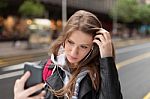 Girl  Listening To Music And Take Selfie Stock Photo