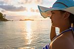 Girl On The Beach At Sunrise Stock Photo