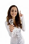 Girl Pointing up with Light Bulb Stock Photo