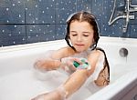 Girl Washing Her Hand In The Bath Stock Photo