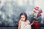 Girl With A Vase Of Flowers Stock Photo