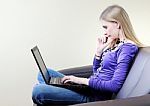 Girl With Laptop At Home Stock Photo