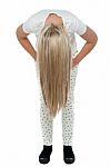 Girl With Long Hair Bending Down Stock Photo