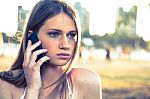 Girl With Smart Phone Near Beach Stock Photo