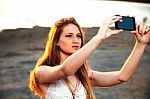 Girl With Smart Phone Near Beach Stock Photo