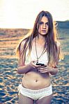 Girl With Smart Phone Near Beach Stock Photo