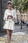 Girl With Smartphone Walking On City Stock Photo