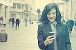 Girl With Smartphone Walking On City Stock Photo