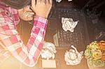 Girl With The Stress On Desk Stock Photo