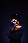 Girl's Face Painted Uv Skull Stock Photo