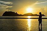 Girls On The Beach During Sunrise Stock Photo