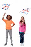 Girls Waving United Kingdom Flags Stock Photo