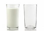 Glass And Glass Of Milk Isolated On White Background Stock Photo